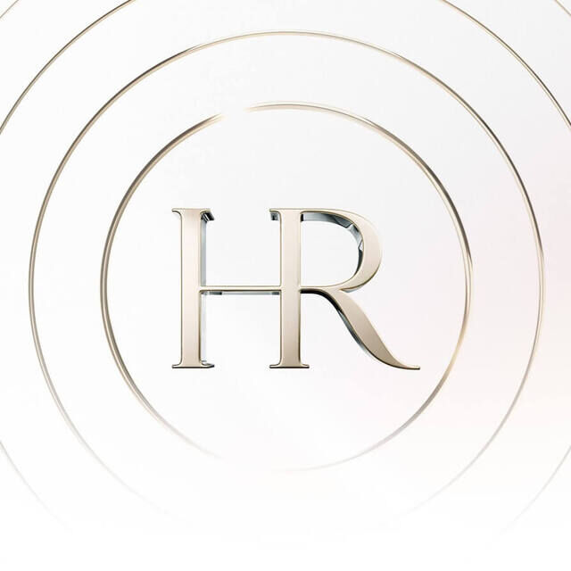 The stylized golden "HR" logo is centered within a circle, surrounded by concentric circles on a bright white background, symbolizing elegance and purity.