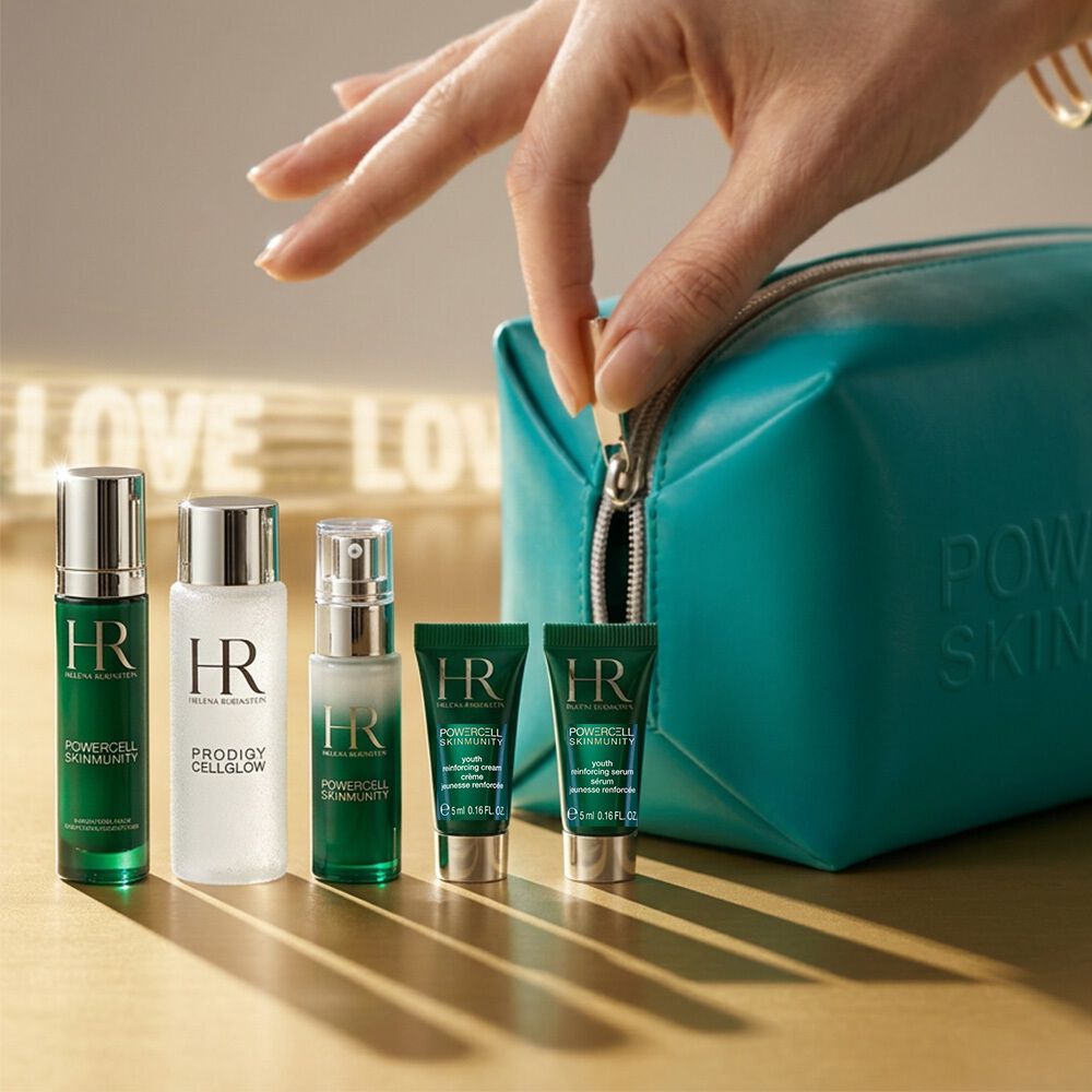 Helena Rubinstein set en wit tasje onder blauweregen.​